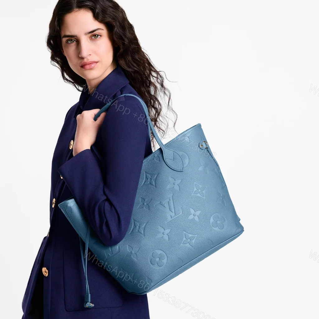 View 9 of Louis Vuitton Neverfull MM Tote Bag Monogram Empreinte Bleu Jean 31cm M27358