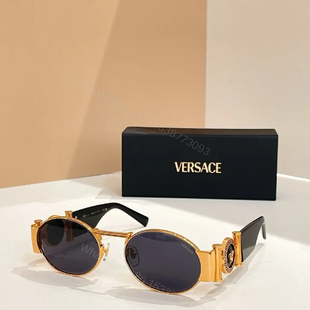 View 3 of Amber-Tinted Round Sunglasses: Gold-Accent, Sculpted Hardware, UV400 Shield