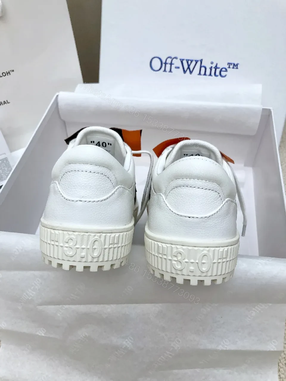 View 2 of White Leather Low-Profile Sneakers with Signature Tape Details