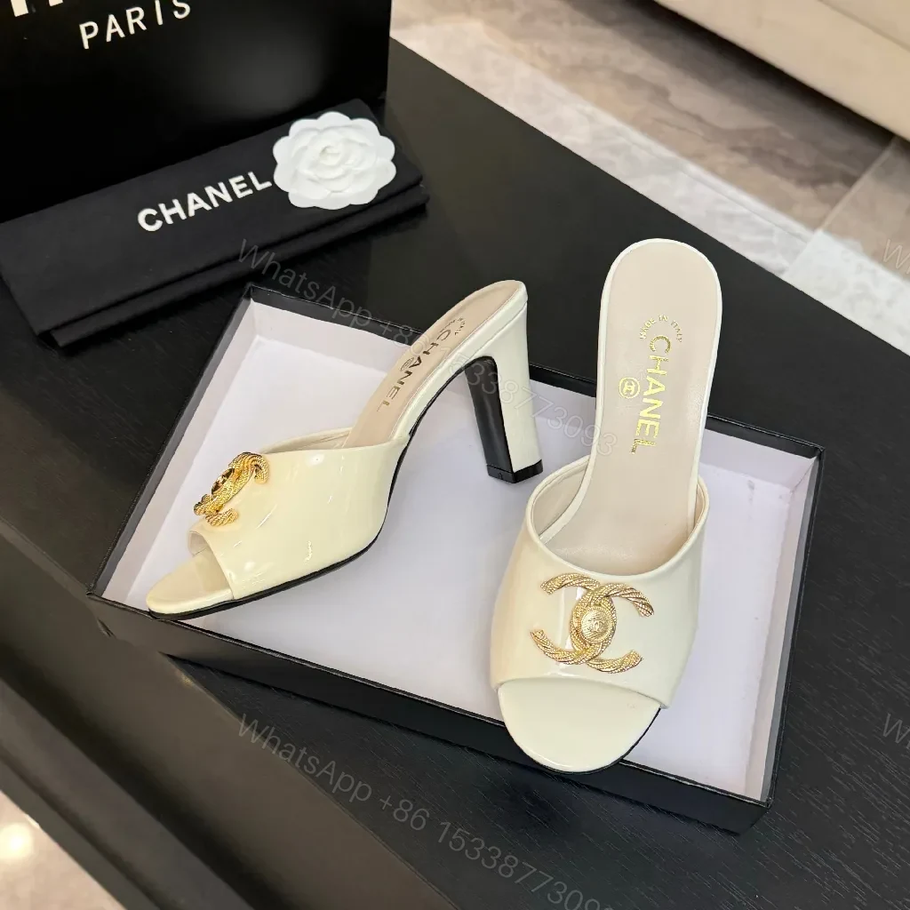 View 9 of White Patent Mules with Gold Logo Embellishment – Sleek Luxury Footwear