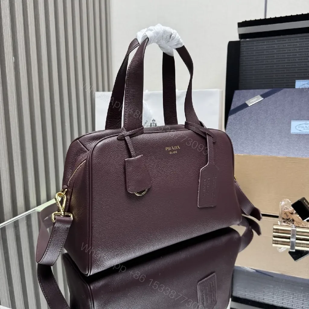 View 2 of Structured Burgundy Pebble-Leather City Bag with Gold Hardware