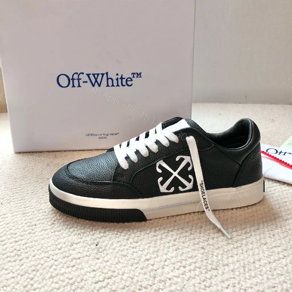 View 8 of Low-Top Black Pebbled Leather Sneakers with Signature Detailing