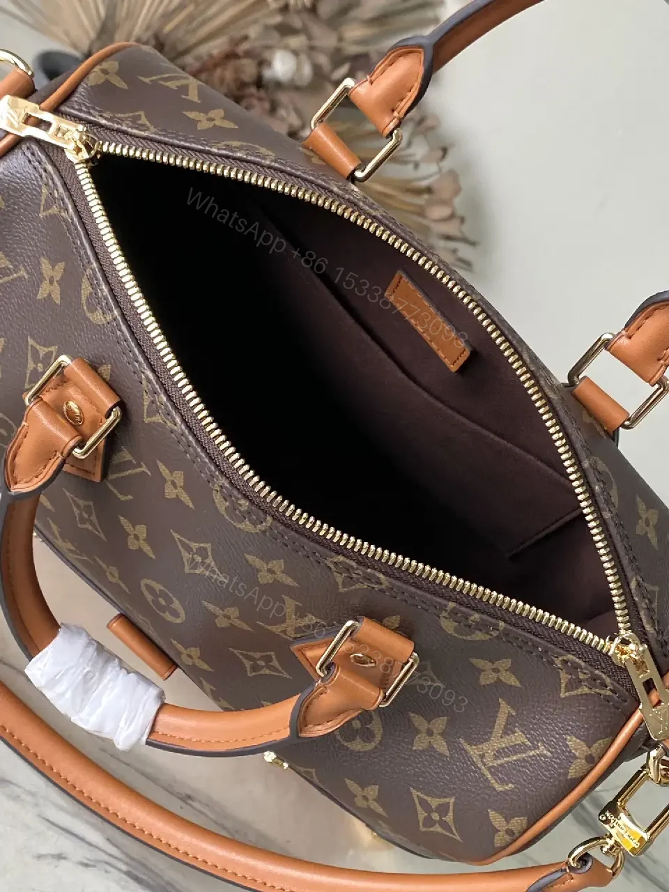 View 2 of Brown Monogram Canvas Satchel with Tan Leather Trim, Structured Style, Gold Hardware, Top Handles