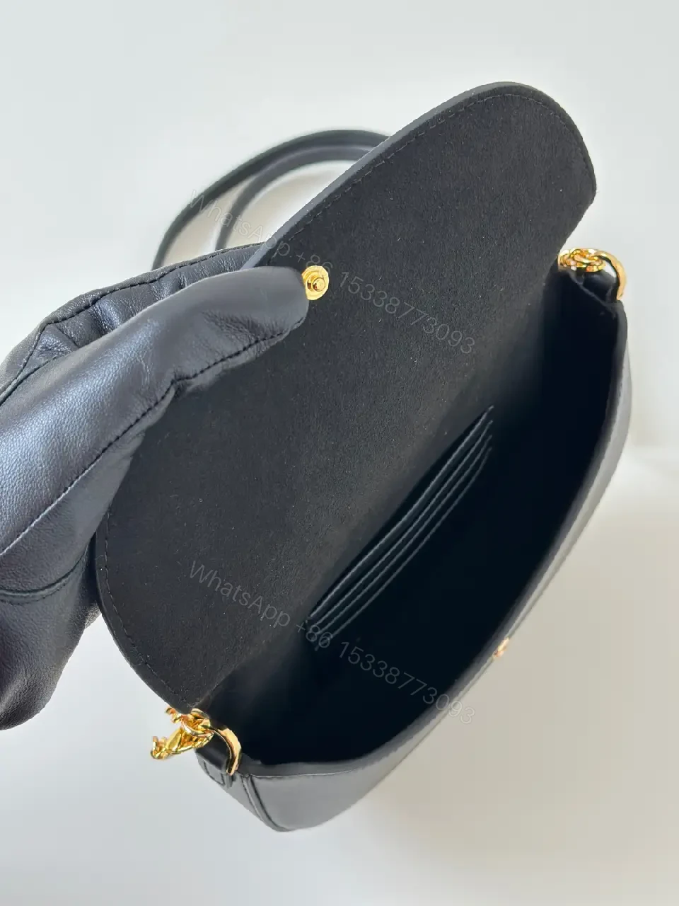 View 8 of Chic Black Leather Shoulder Bag with Gold Hardware, Compact Luxury
