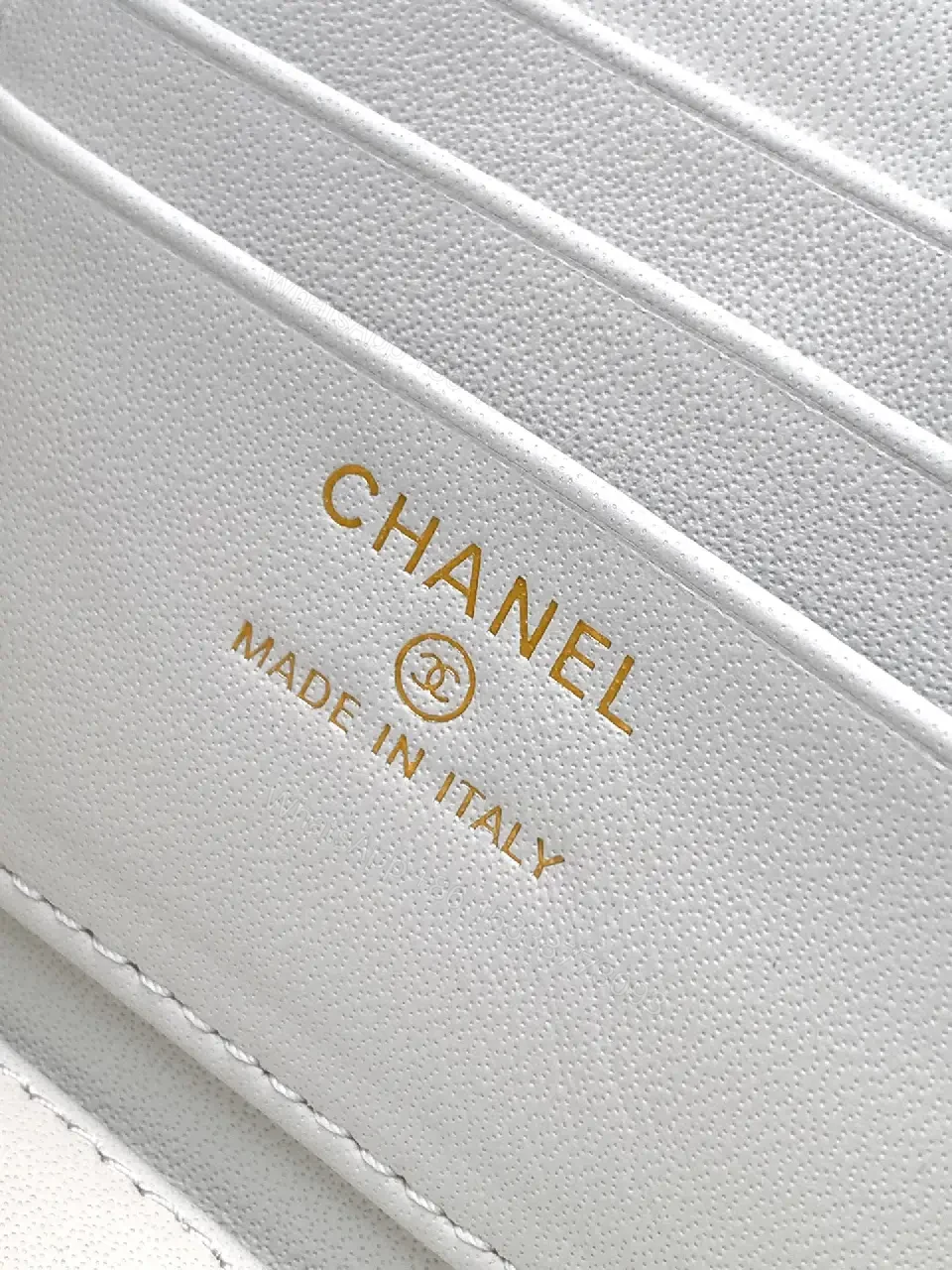 View 3 of white quilted leather bag with chain strap for everyday luxury