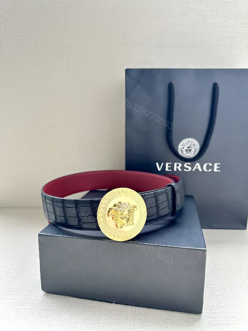 View 2 of Textured Leather Belt with Medusa Buckle - Crocodile-Embossed, Black/Burgundy, Luxury Belt