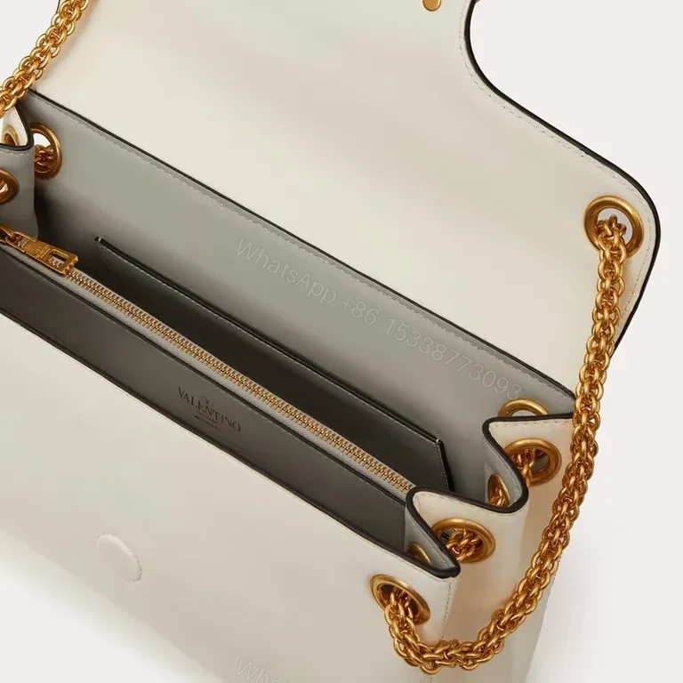 View 3 of Chic White Rockstud Shoulder Bag â€“ Everyday Luxury