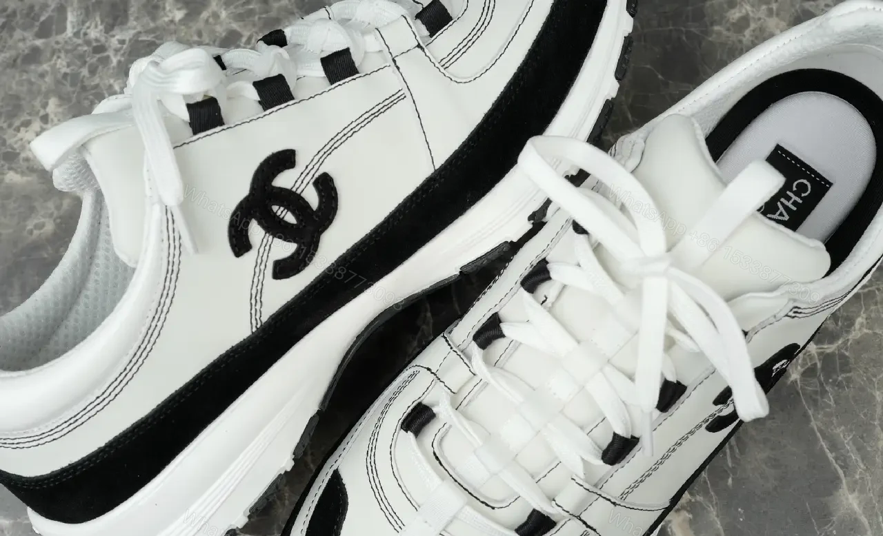 View 3 of White Leather Chunky Sneaker with Chanel Logo Details