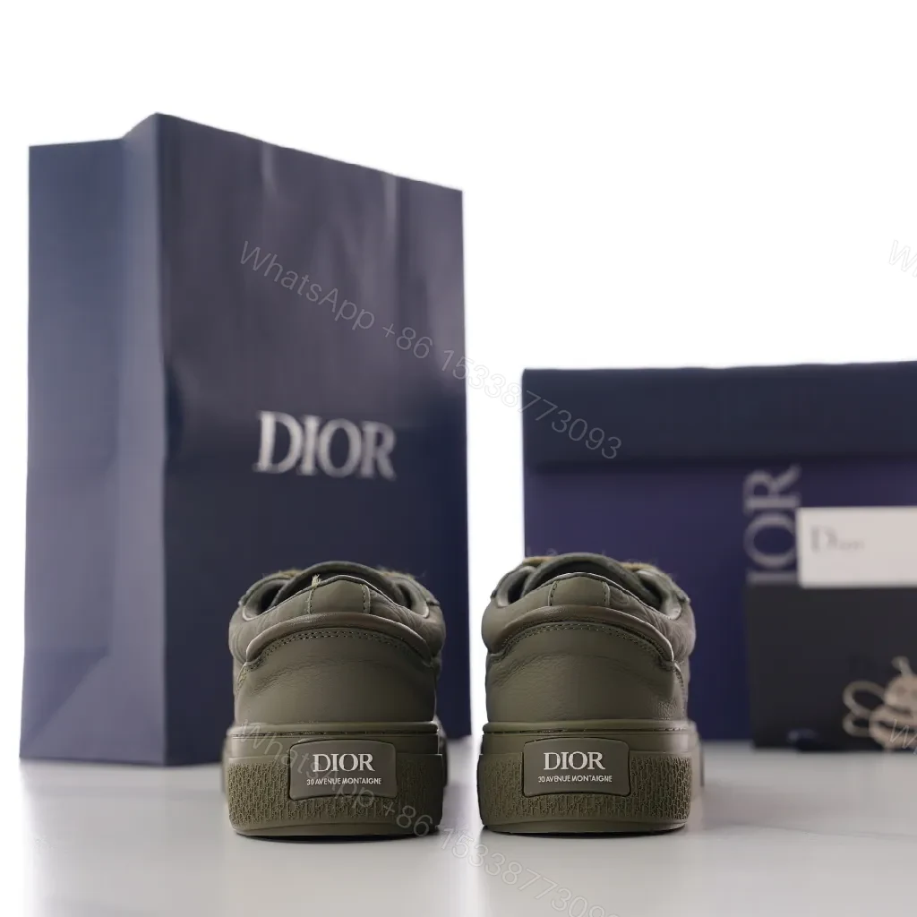 View 9 of Olive Luxe Olive Suede-Leather High-Top Sneaker with Monogram Embossing