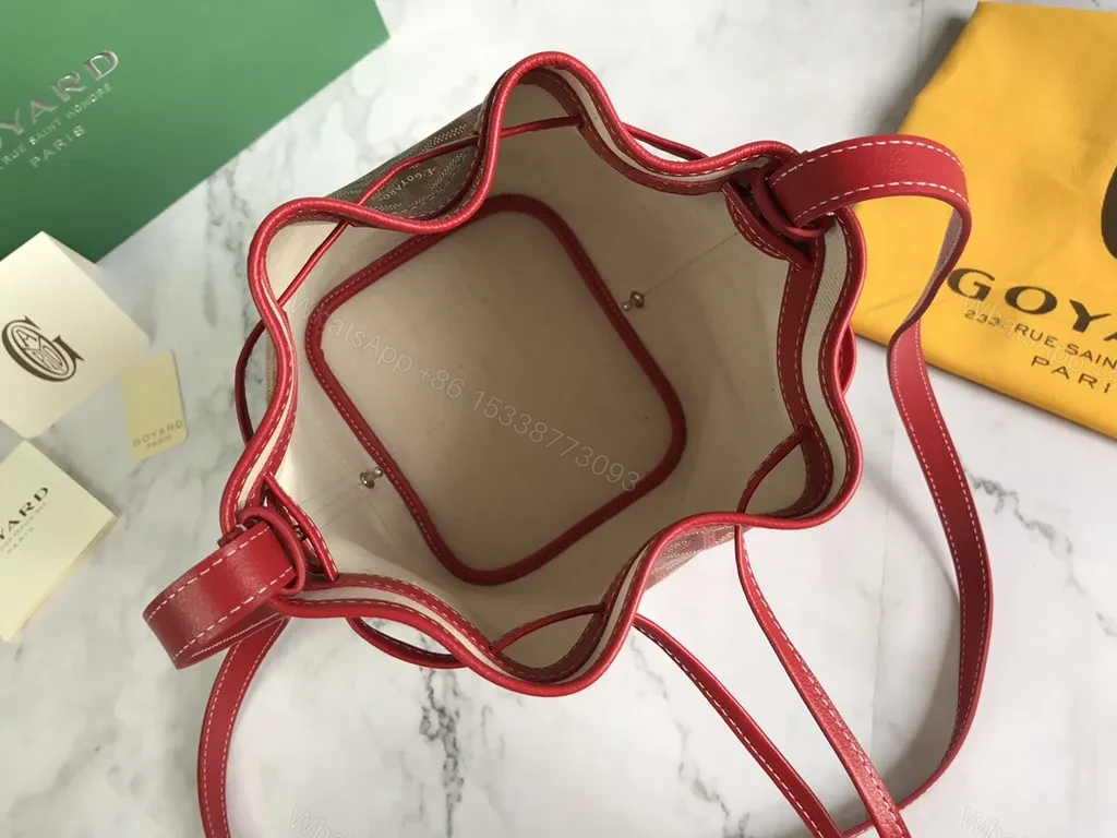 View 9 of Bold Goyardine Bucket Bag in Red Leather Trim