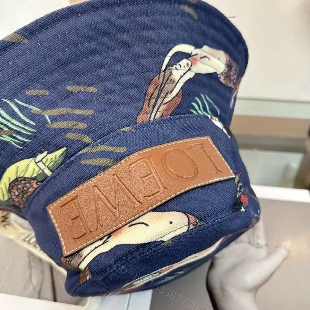 View 10 of Navy Floral Canvas Bucket Hat with Leather Brand Patch