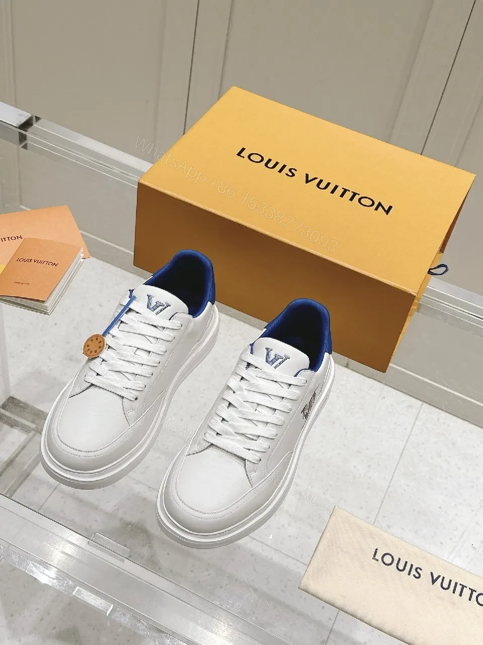 View 4 of Clean White Leather Low-Top Sneakers with Subtle Designer Embellishments
