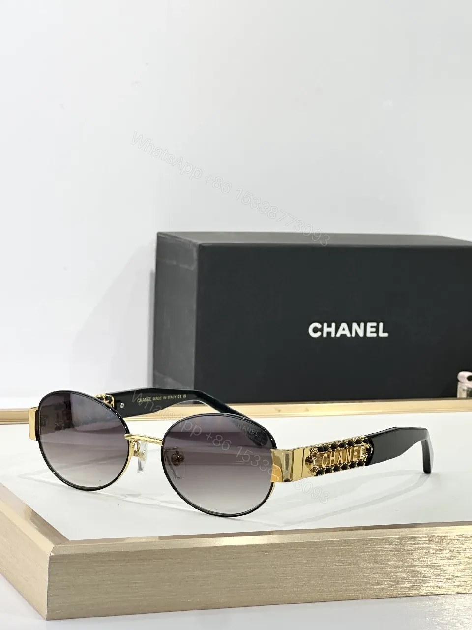 View 8 of Gold-Accented Round Sunglasses: Minimal Luxury Shield