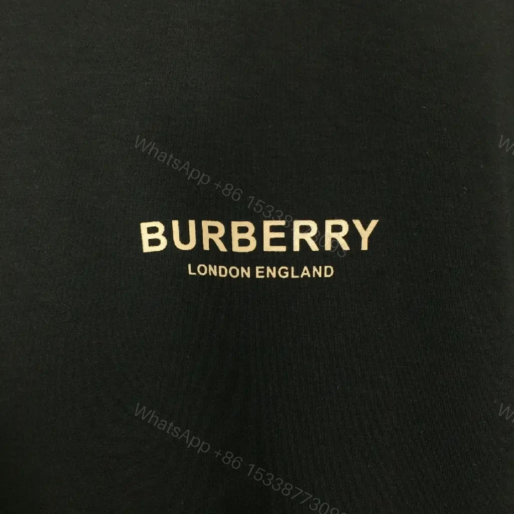View 8 of Minimalist Black Cotton Tee, Subtle Logo, Everyday Comfort