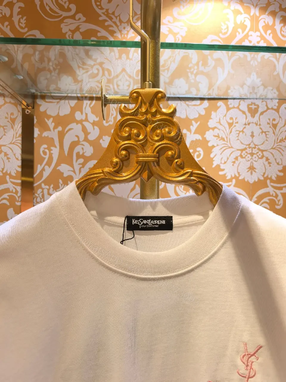 View 3 of Minimalist White Cotton Tee with Subtle Saint Laurent Detail