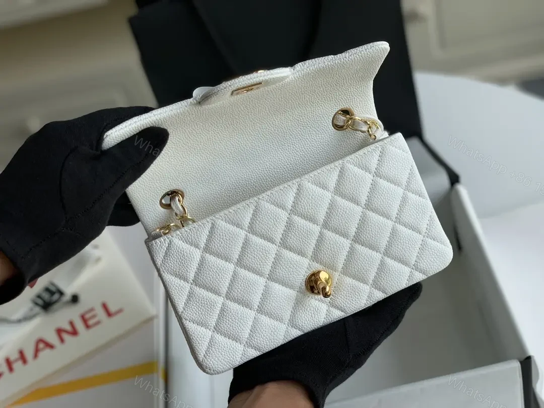 View 3 of Quilted White Flap Bag with Gold Hardware—Compact Elegance