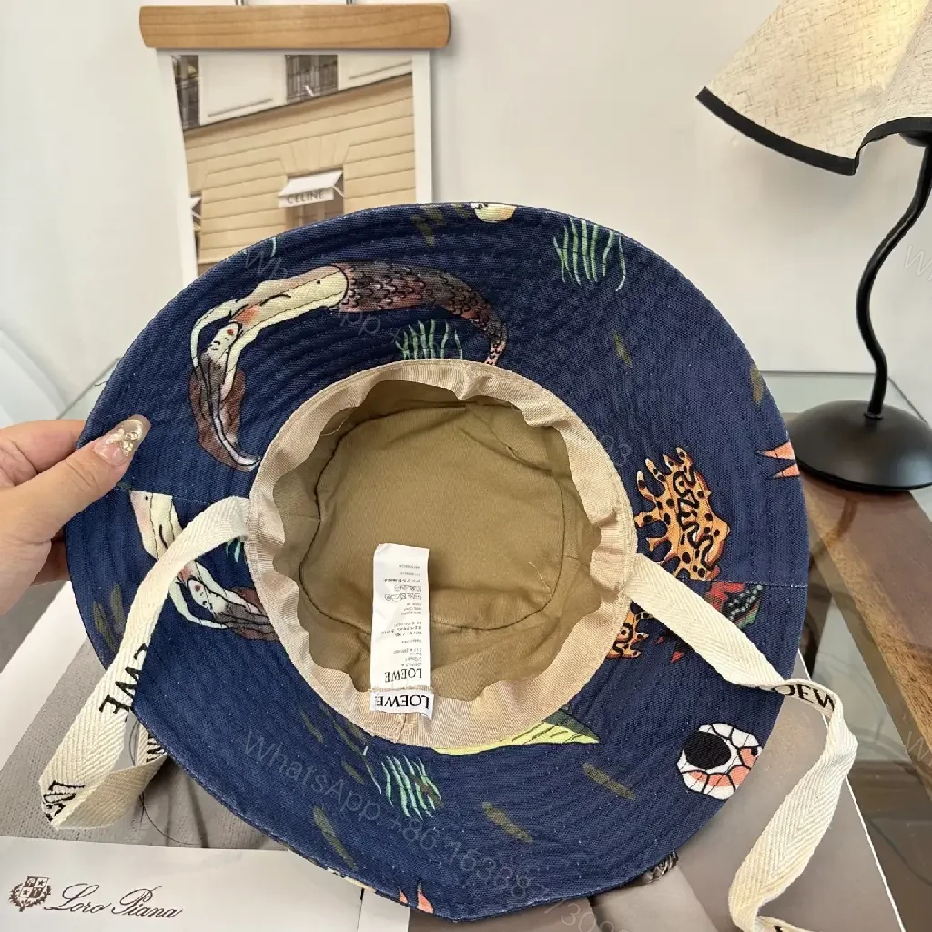 View 7 of Navy Floral Canvas Bucket Hat with Leather Brand Patch