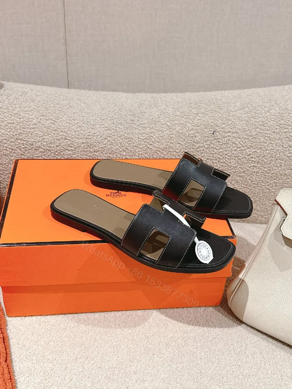 View 4 of Patterned Stride Sandals in Black Leather – Luxury Flat Slides