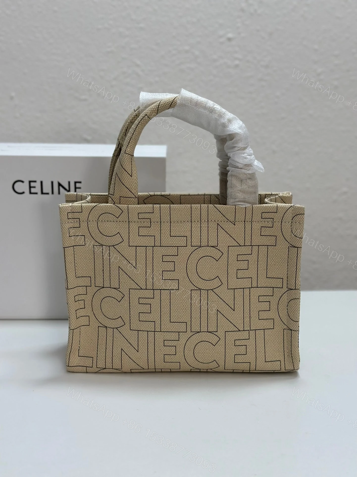View 2 of CELINE SMALL CABAS THAIS IN TEXTILE WITH ALL-OVER PRINT NATURAL TAN 25CM