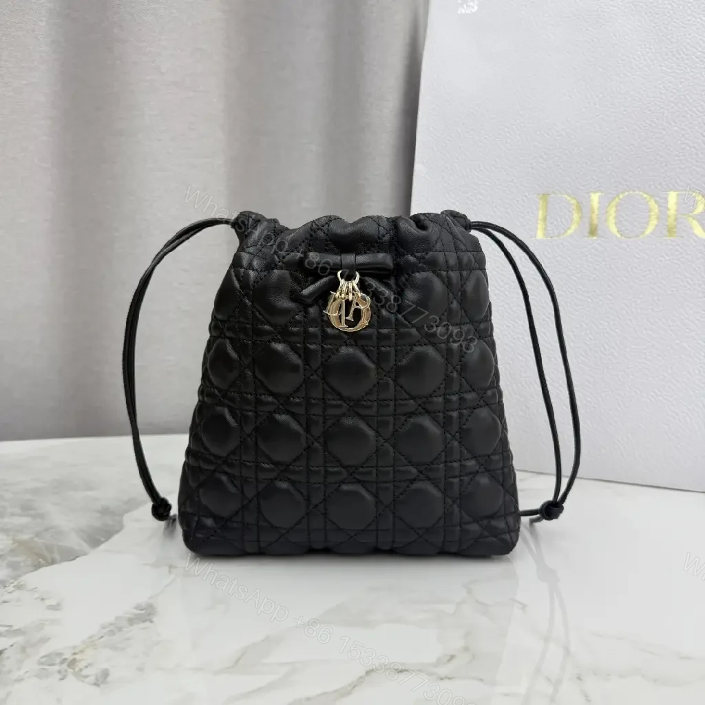 View 7 of Quilted Black Drawstring Bucket Bag with Gold Hardware