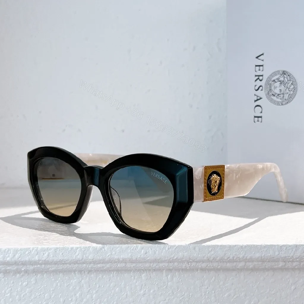 View 4 of Bold Tortoise Cat-Eye Sunglasses with Gold Medallion Accents