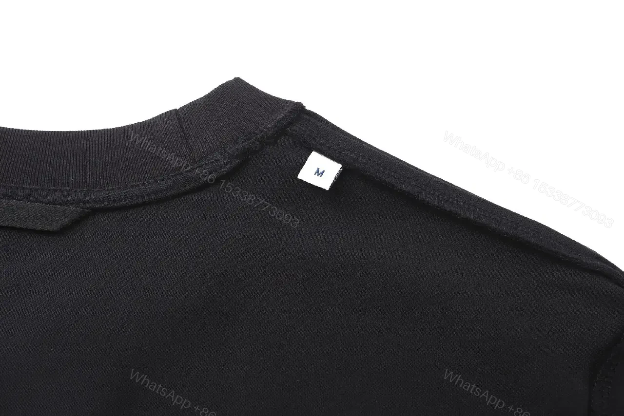 View 4 of Minimalist Cotton Crest Tee - Black Luxe Tee