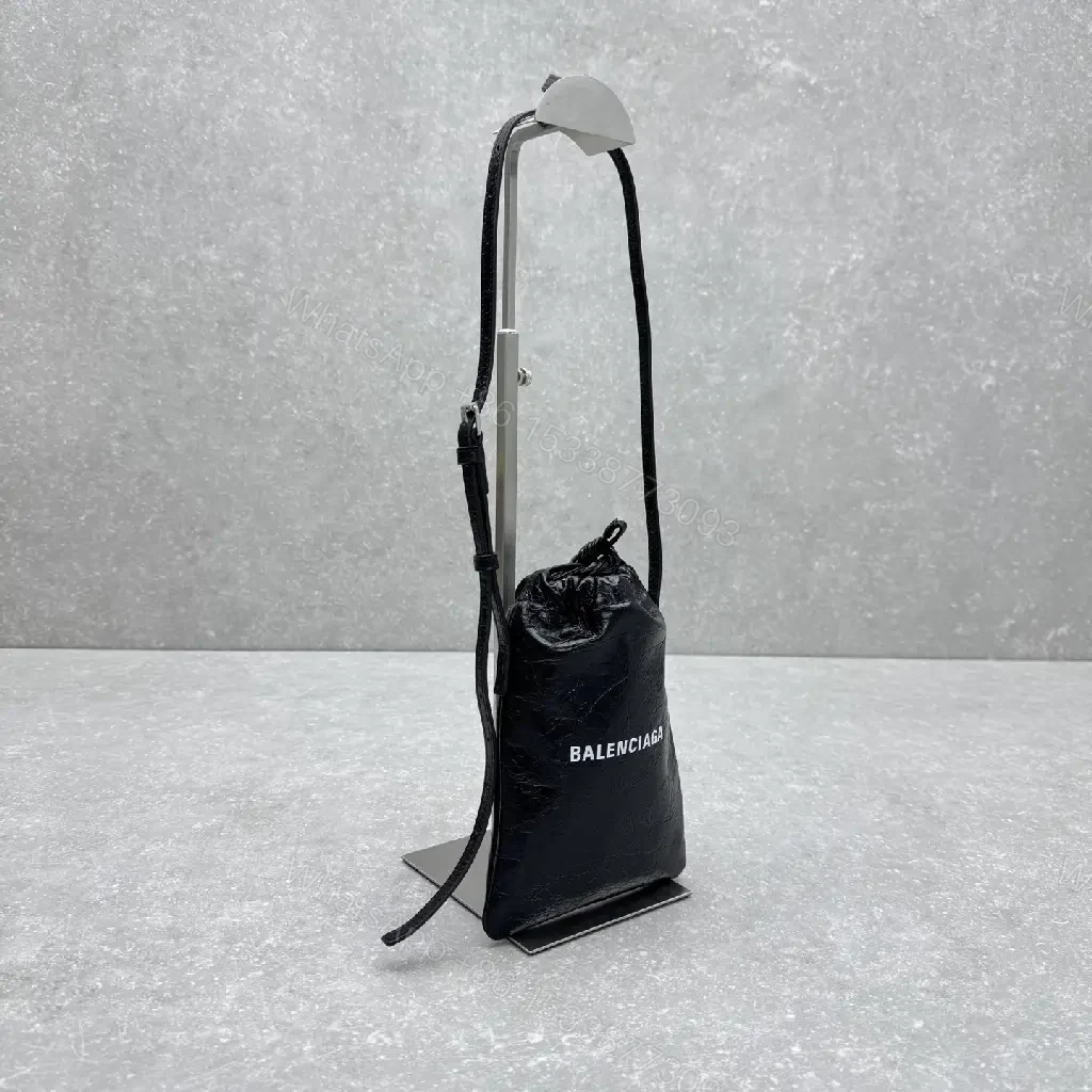 View 5 of Black Leather Drawstring Crossbody Bag - Minimalist Luxe Compact Carry