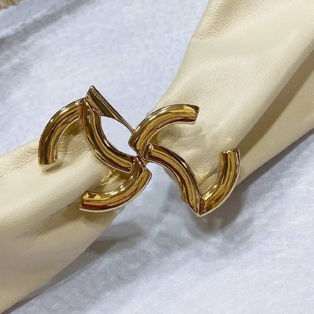 View 2 of Ivory Faux Leather Headband with Gold Logo Emblem - Chic, Everyday Glam