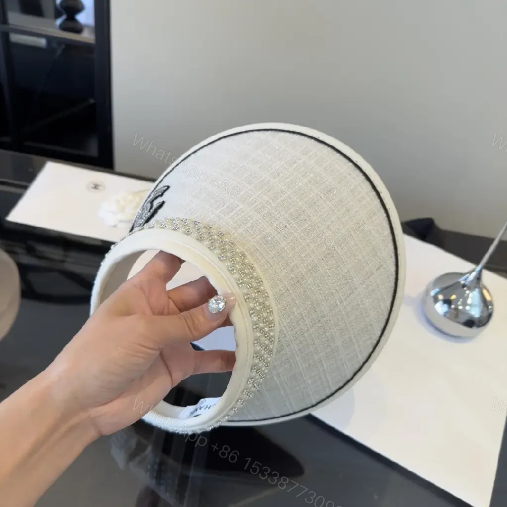 View 7 of Light Gray Linen Visor Cap with Rhinestone Collar and Chanel Logo