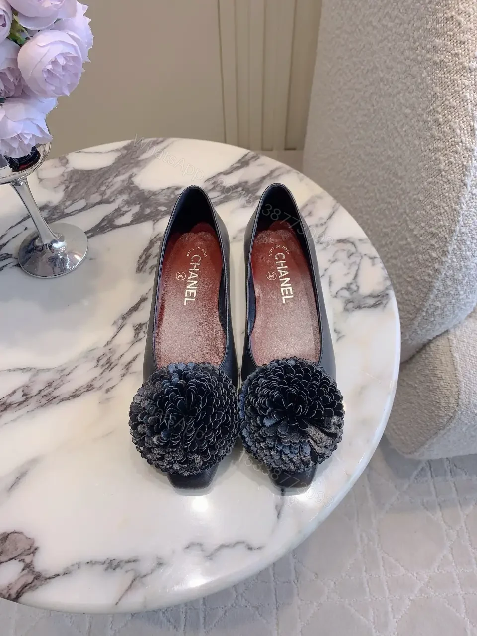 View 2 of Chic Black Pointed Flats with Floral Pom-Pom Detail