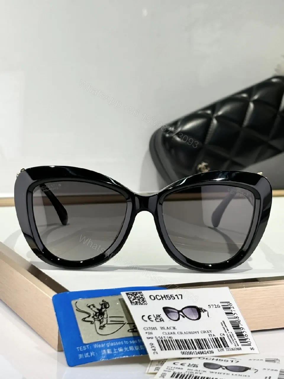 View 4 of Oversized Black Cat-Eye Sunglasses with Subtle Logo Details