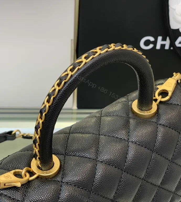 View 3 of Chic Quilted Black Handbag with Gold Twist â€” All-Day Comfort