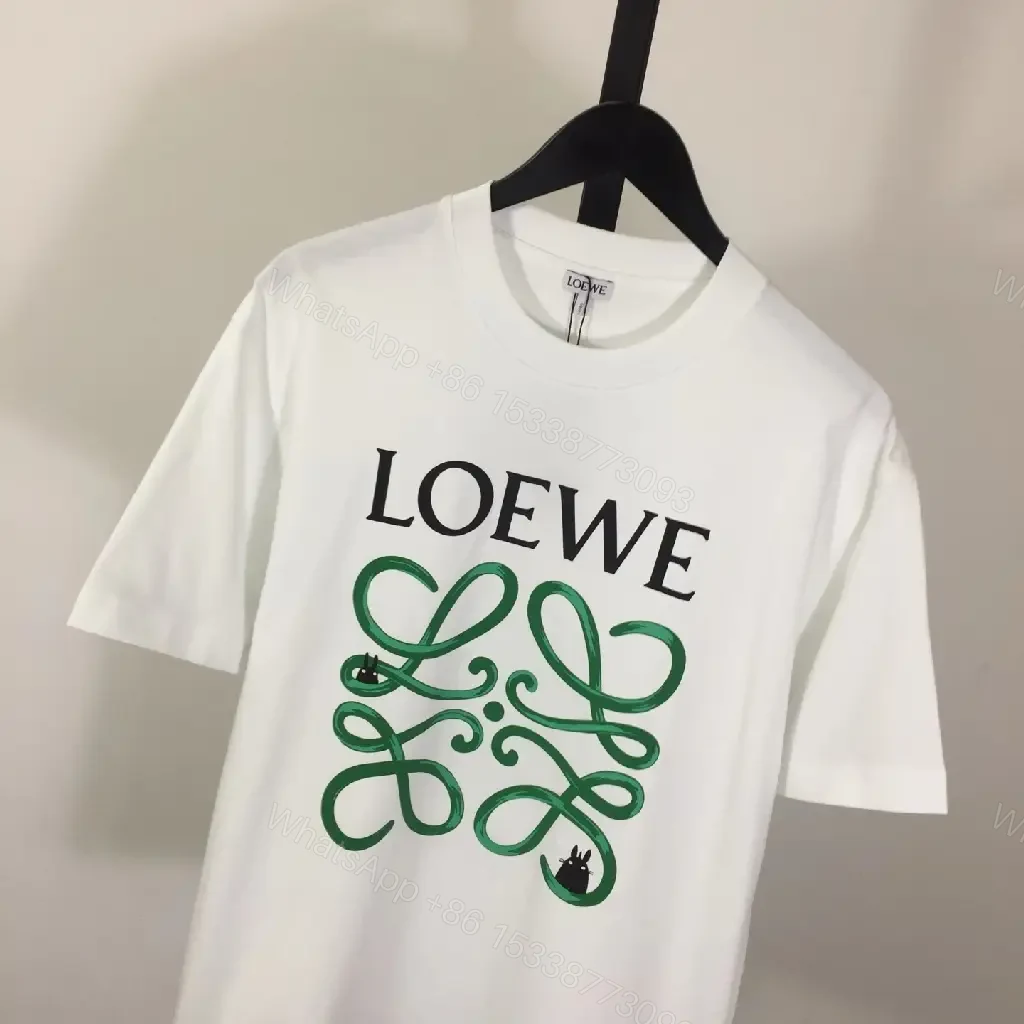 View 2 of White Cotton Graphic Tee – Opulent Comfort, Bold Logo, Casual Luxury