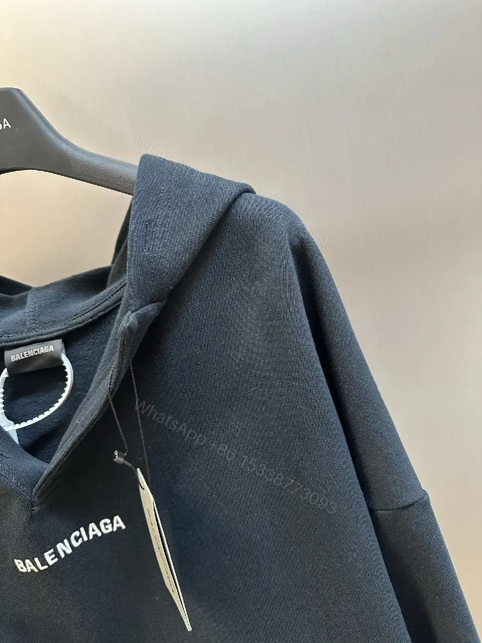 View 2 of Cozy Luxe Hoodie: Subtle Iconography, Everyday Versatility