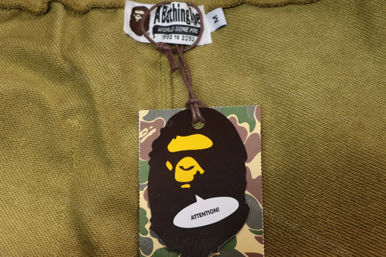 View 5 of BAPE Camouflage Shark Mouth Shorts Green