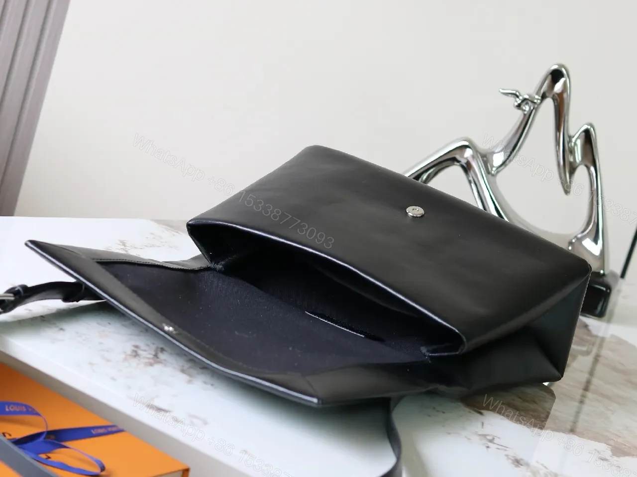 View 8 of Structured Minimalist Clutch: Luxe Faux Leather, Embossed Logo, Magnetic Closure