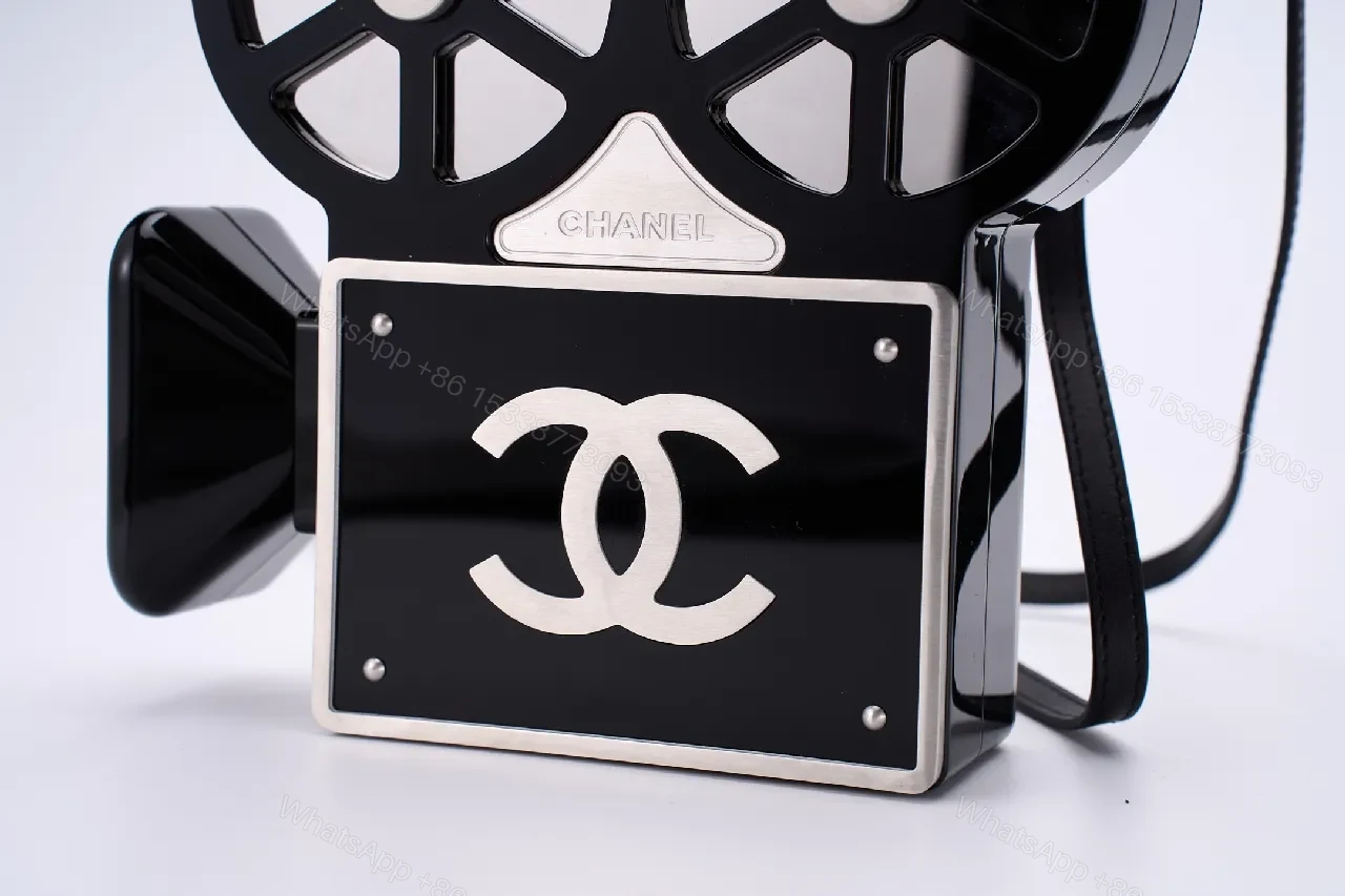 View 6 of Compact Reel-Clutch: Lux Gloss Hardware with Architectural Silhouette