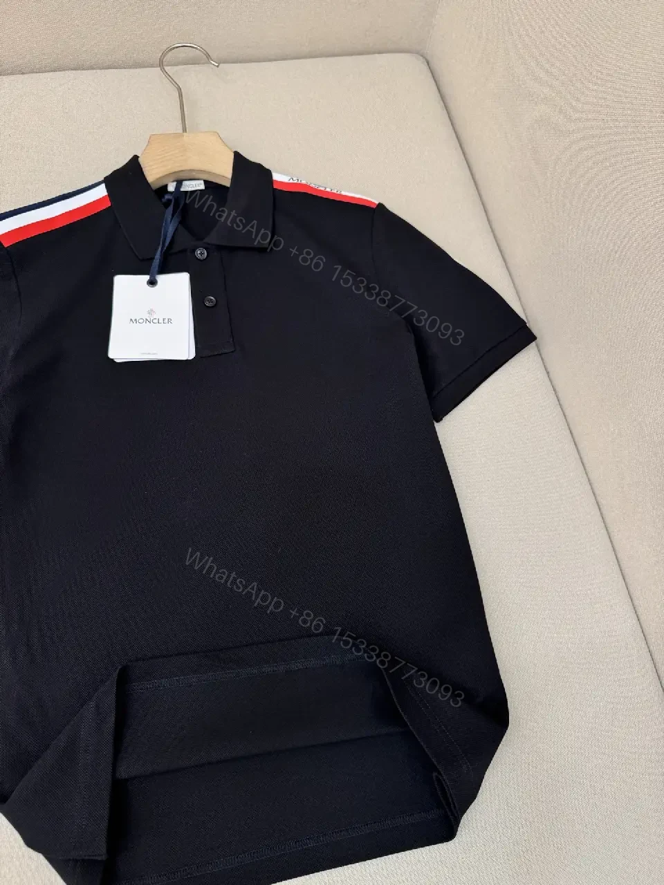 View 4 of Navy cotton polo shirt with red-white striped shoulder accents for everyday luxury