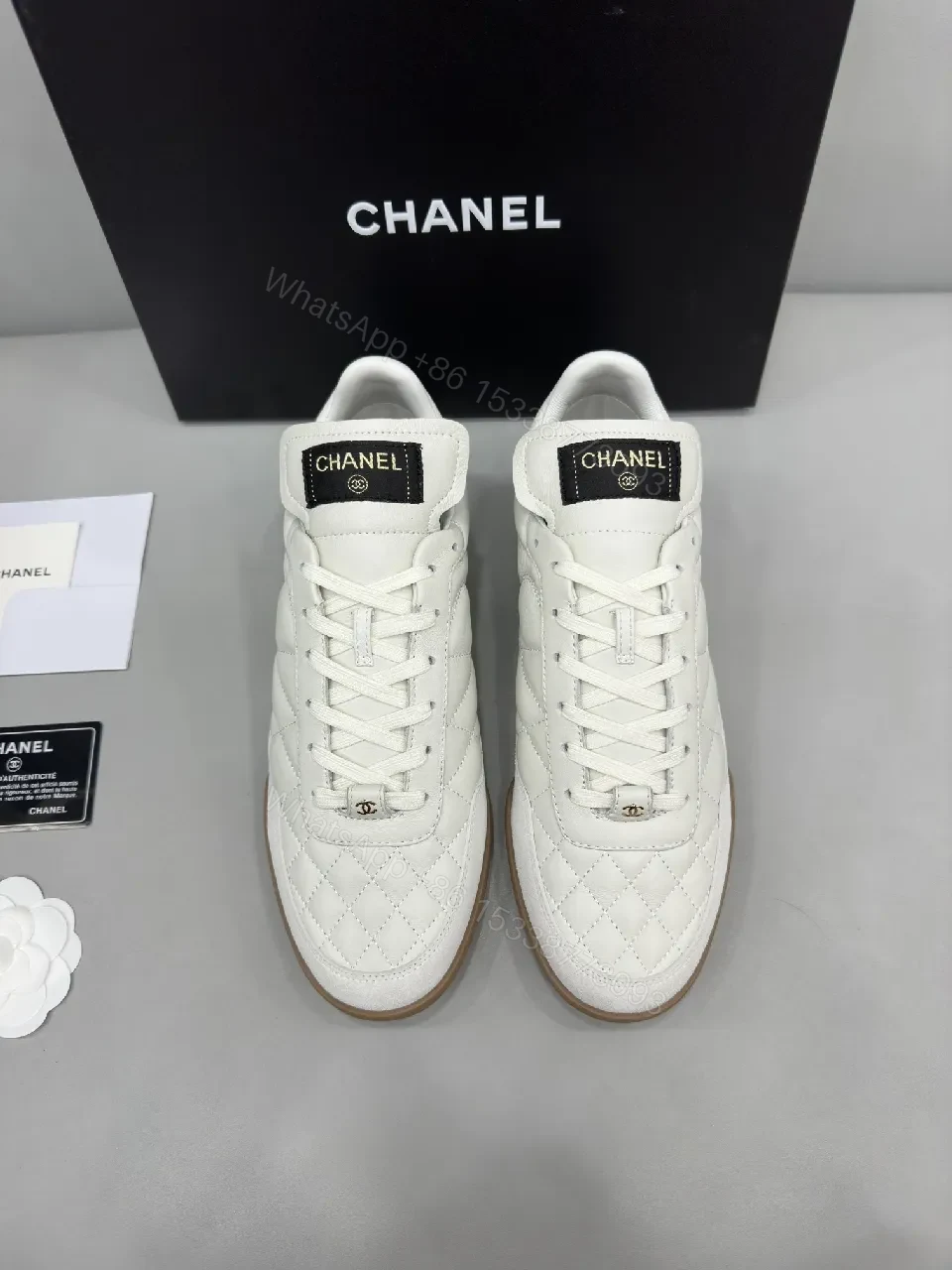 View 6 of White Quilted High-Top Leather Sneakers with Signature Details