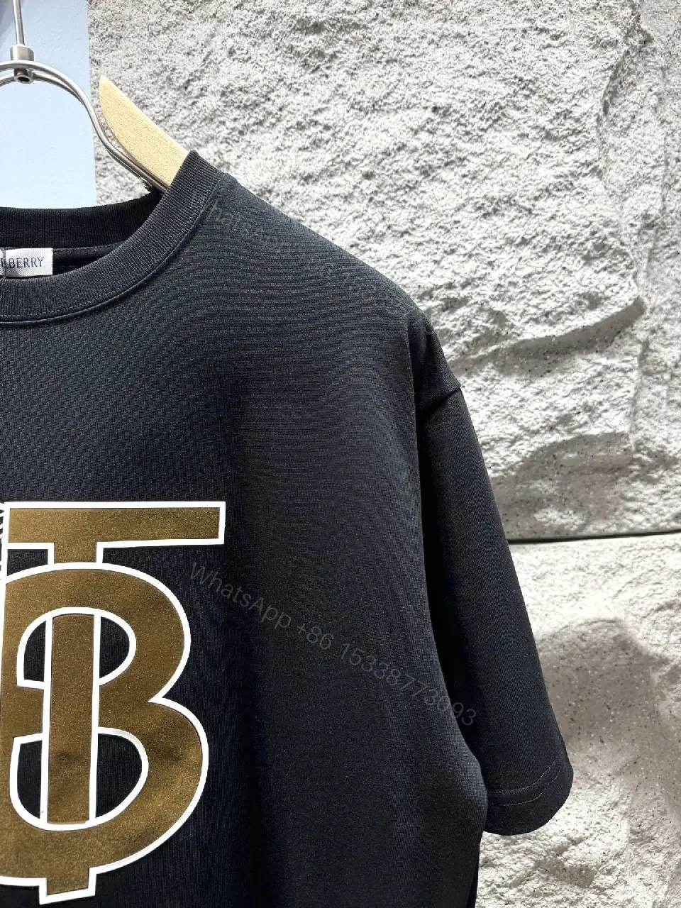 View 4 of Statement Black Cotton Tee with Bold Metallic Logo Detail