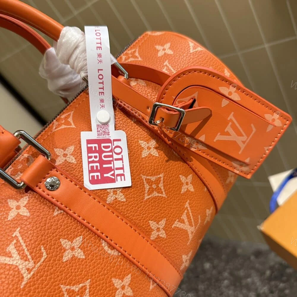 View 5 of Louis Vuitton Keepall Bandoulière 25 Tangerine 25Cm M31044