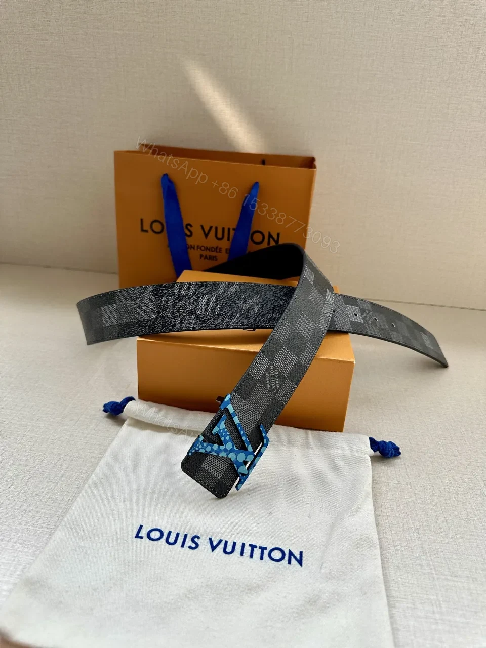 View 6 of Bold Checker Belt with Blue Buckle — Modern Luxury Accessory