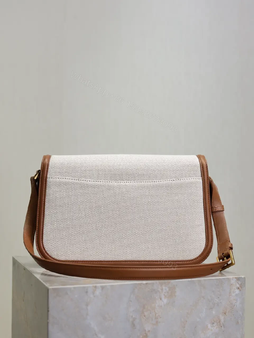 View 2 of Textured Crossbody Bag: Gold Hardware, Leather Trim, Chic Modern
