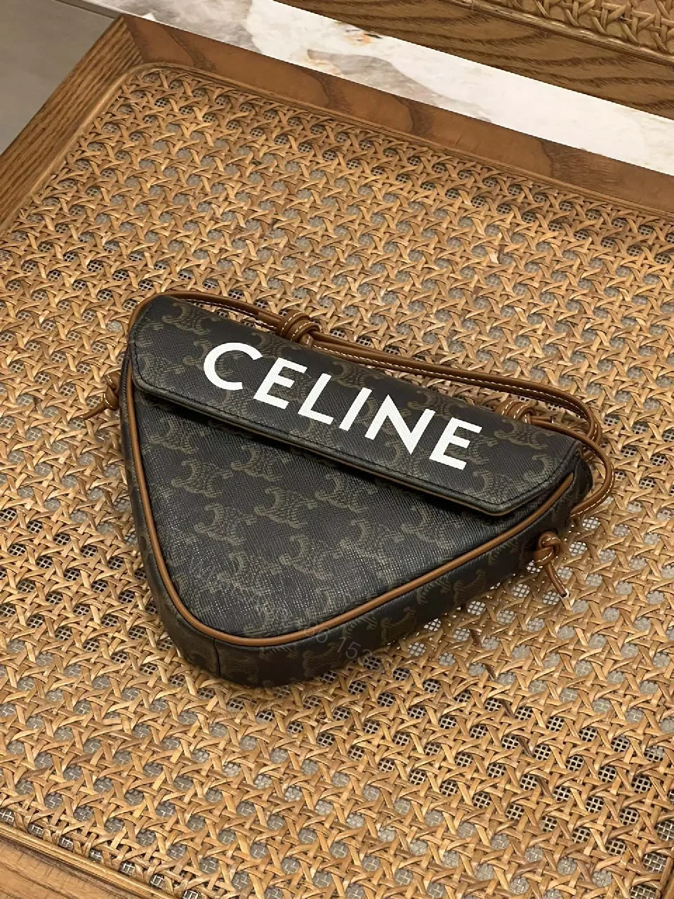 View 8 of Chic Black Monogram Cocoon Bag: Compact Luxury Crossbody