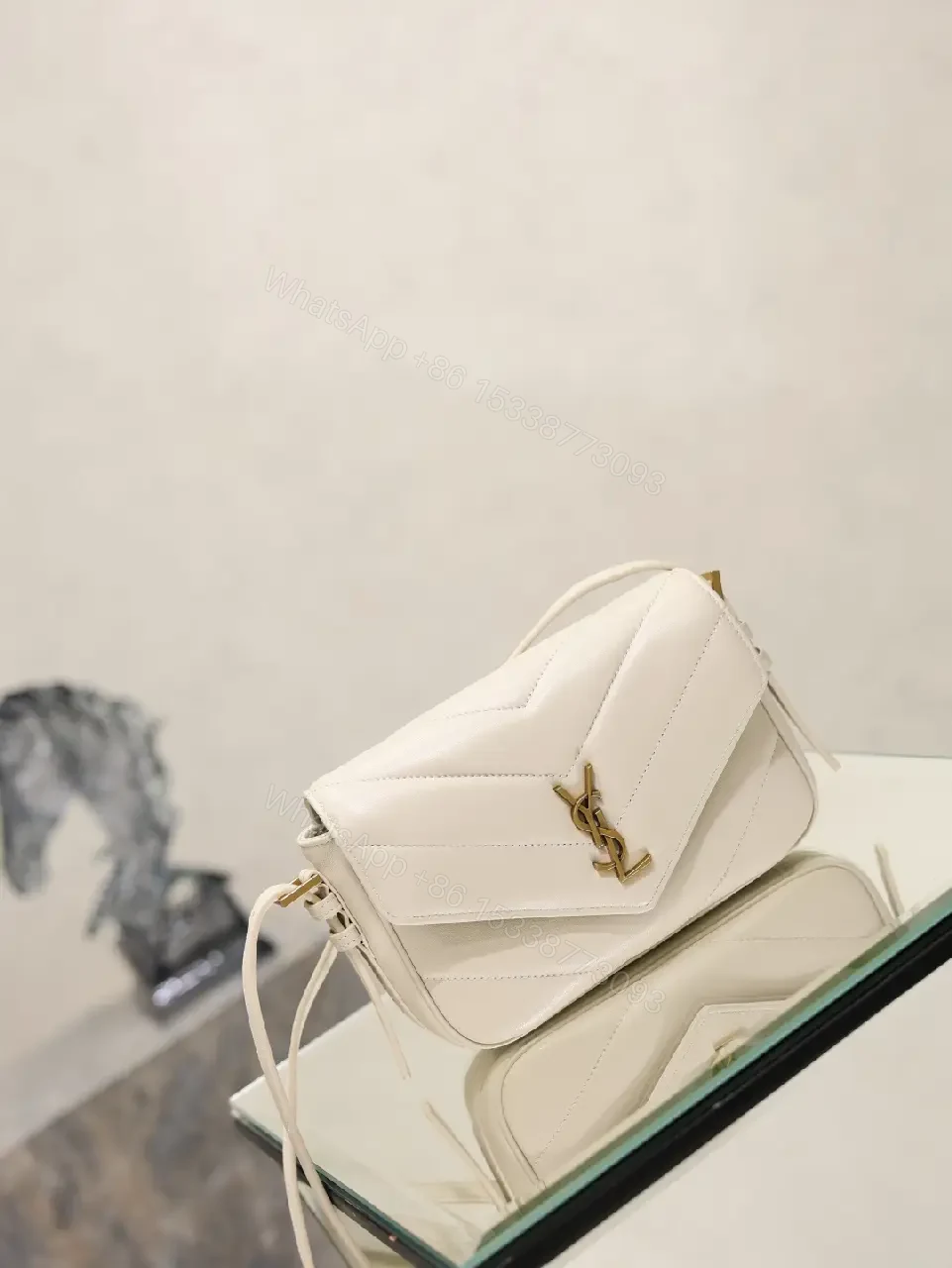 View 9 of Off-White Cream Leather Mini Crossbody Bag with Chevron Front Feature