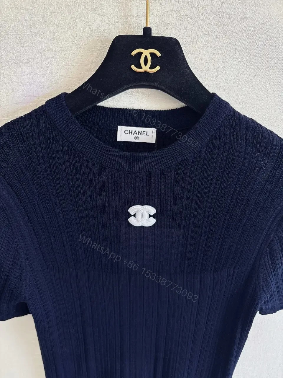 View 3 of Navy Knit Tee: Ribbed Texture, Subtle Crest Emblem, Luxe Casual