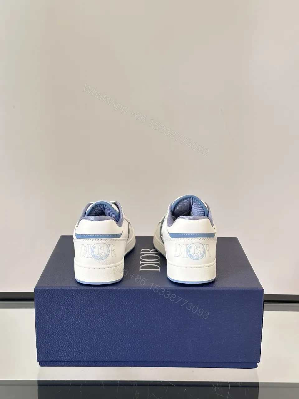 View 2 of White & Sky Blue Leather High-Tops with Subtle Monogram Texture