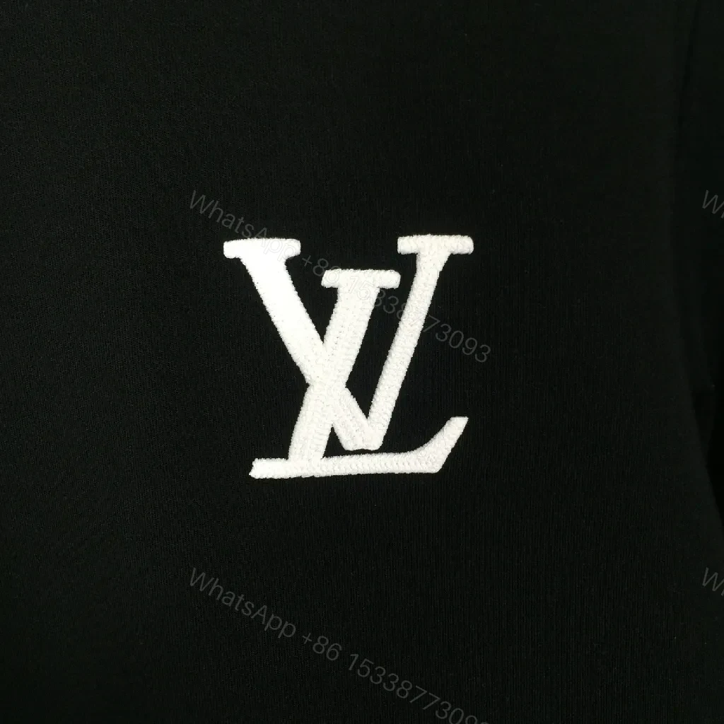 View 2 of Minimalist Black Sweatshirt with Subtle Monogram Accent