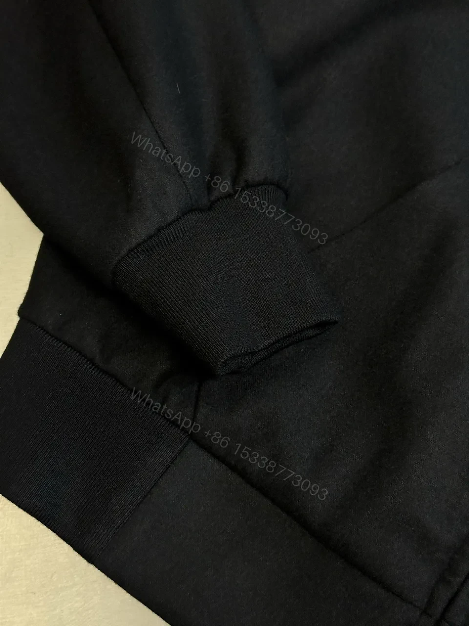 View 5 of Black Leatherette Minimal Zip Hoodie with LV Emblem