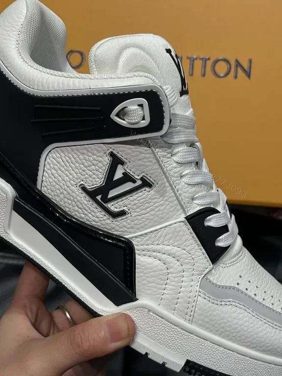 View 2 of White Leather High-Top Sneakers with LV Branding and Visible Hardware